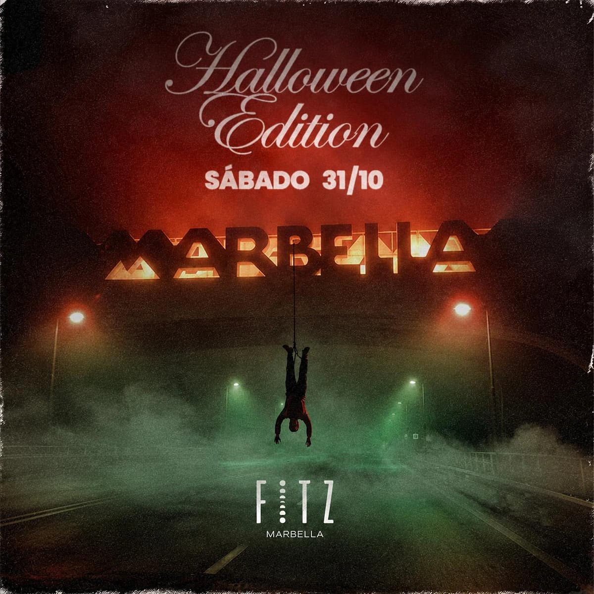Cartel Halloween Edition de FITZ Marbella para el 31 de octubre, con carretera nocturna entre niebla, luces verdes y rojas y una figura suspendida.