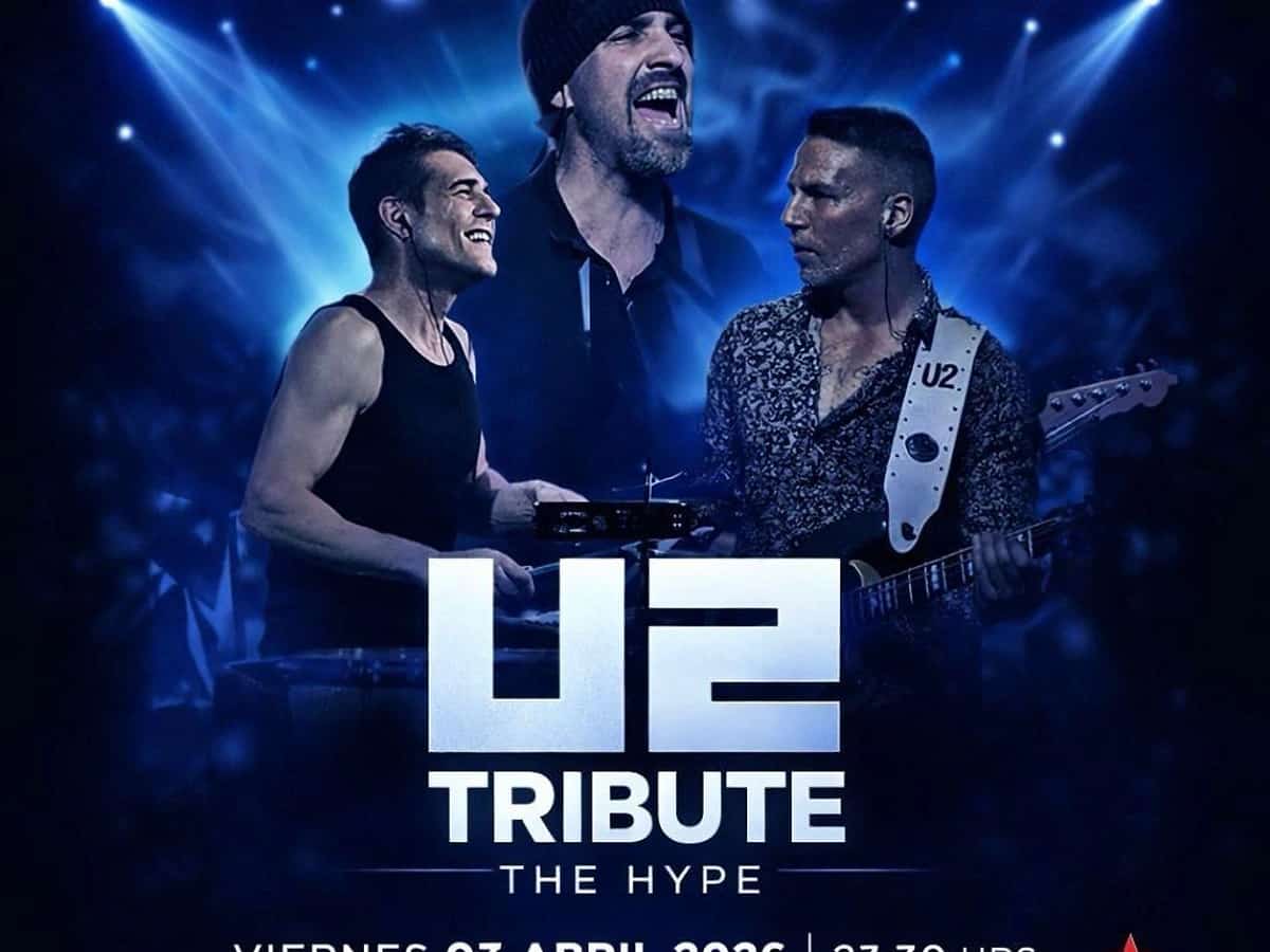 Cartel promocional de The Hype, tributo a U2, en Premiere Club con tres músicos sobre un fondo azul de luces de escenario. El concierto es el viernes 3 de abril de 2026 a las 23:30 h en Marbella.