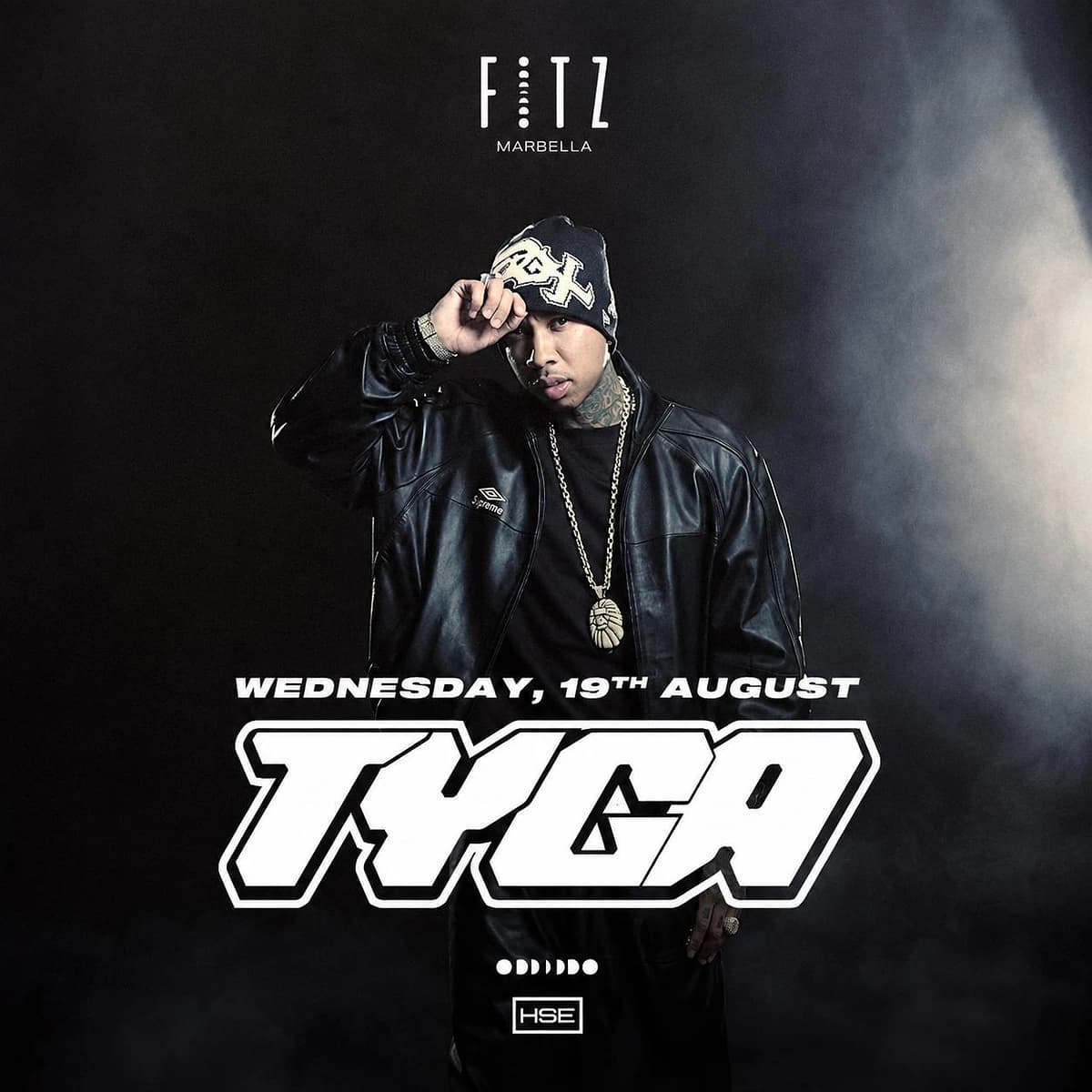 Cartel de Tyga en FITZ Marbella para el miércoles 19 de agosto, con fondo negro, retrato del artista con gorro, chaqueta de cuero y joyas, y gran tipografía blanca.